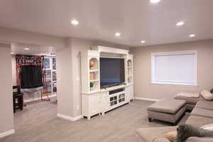 Living room featuring light carpet and recessed lighting