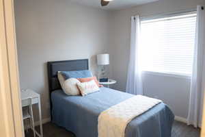 Bedroom with ceiling fan and baseboards