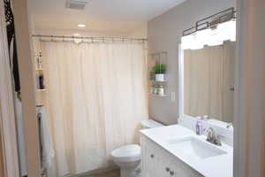 Bathroom featuring vanity and a shower with curtain
