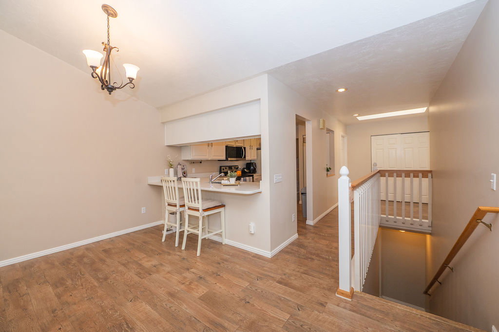 Dining area, hall, and stairs to the basement.