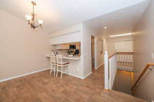 Dining area, hall, and stairs to the basement.