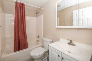 Full bathroom with shower / bath combo.