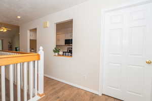 Entry way, looking toward the kitchen. The door goes into the laundry room, also accessible through the kitchen.