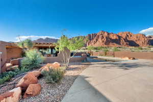 View of yard with a patio and a mountain view