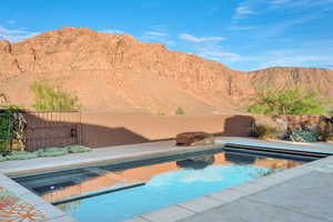 View of swimming pool featuring a mountain view and patio surround