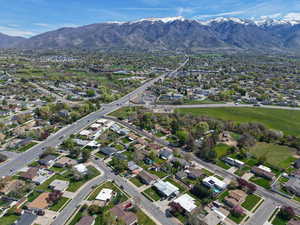 Aerial view of property's location featuring mountains and nearby suburban area
