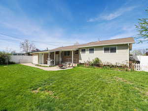 Rear view of property with a patio