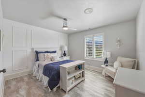 Bedroom featuring ceiling fan and light wood-style flooring