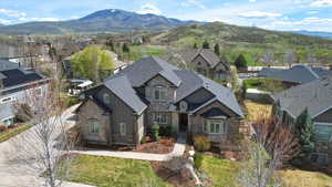Aerial perspective of suburban area featuring a mountain backdrop