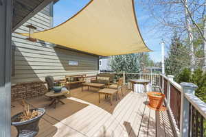 Wooden terrace with an outdoor hangout area
