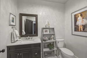 Bathroom with toilet and vanity