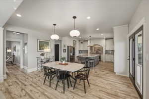 Dining area featuring recessed lighting and light wood-style flooring