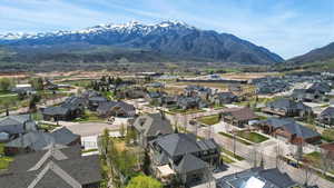 Aerial view of residential area featuring a mountainous background