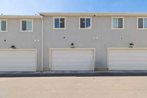 Rear view of property featuring stucco siding