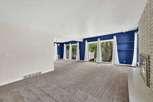 West windows and sliders offer ample light
