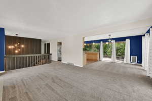 Living room flows to dining room and kitchen