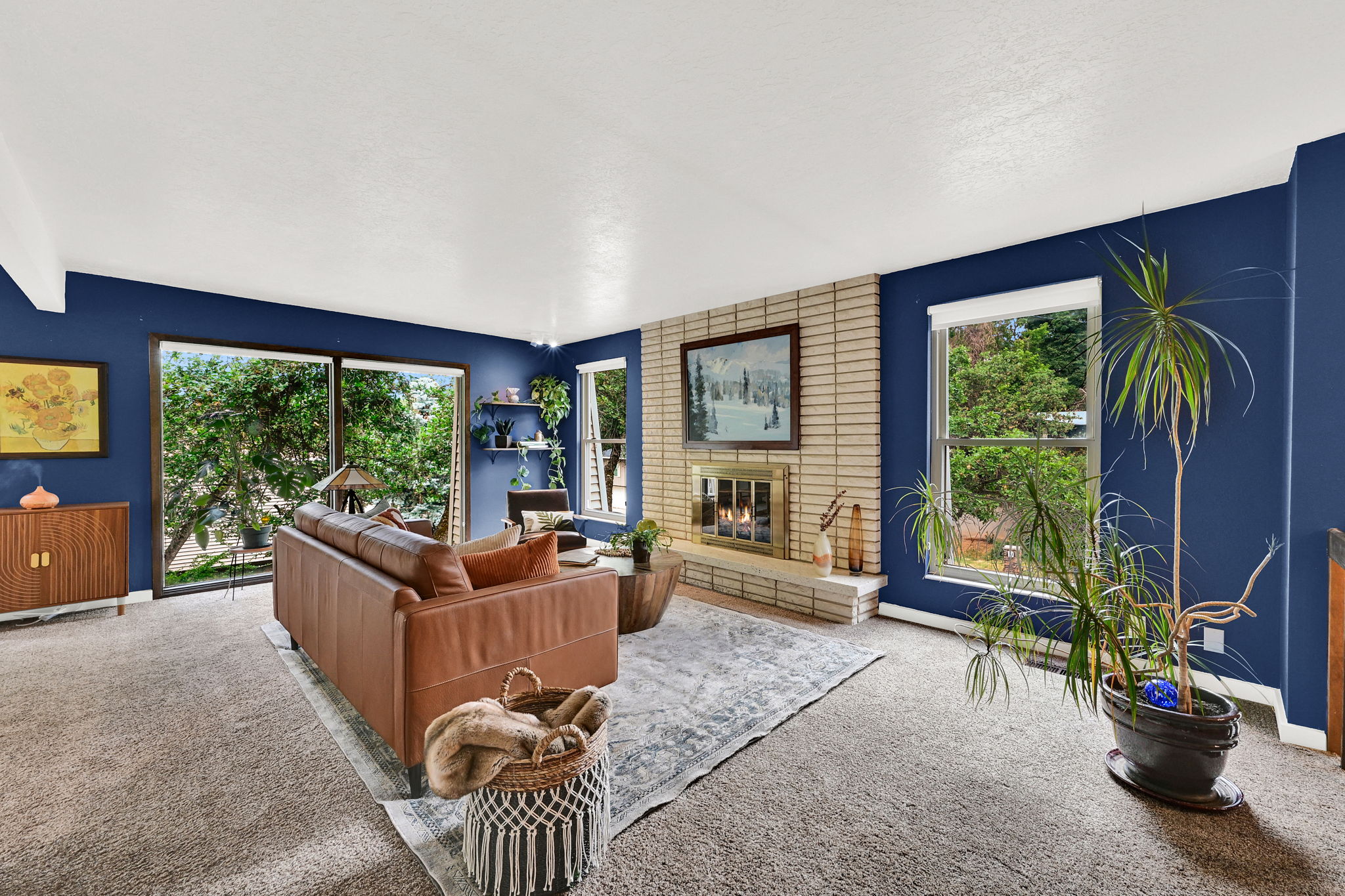 Living area featuring large, light-giving windows