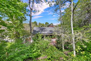 Back of home as seen from wooded lot