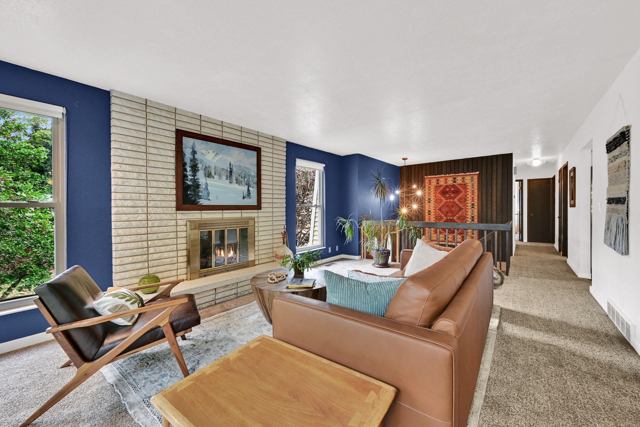 Living area featuring a brick gas fireplace