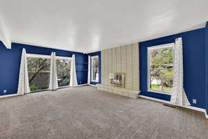 Multiple oversized windows bathe the living room with light