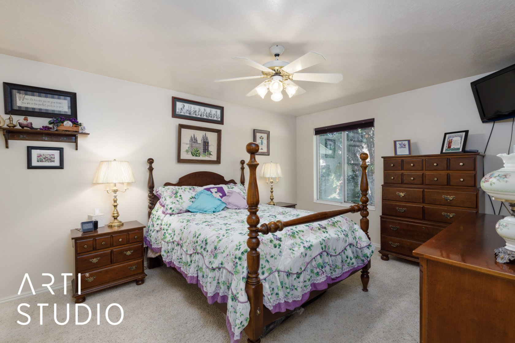 Bedroom with ceiling fan and light colored carpet