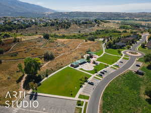 Aerial view of property and surrounding area with mountains