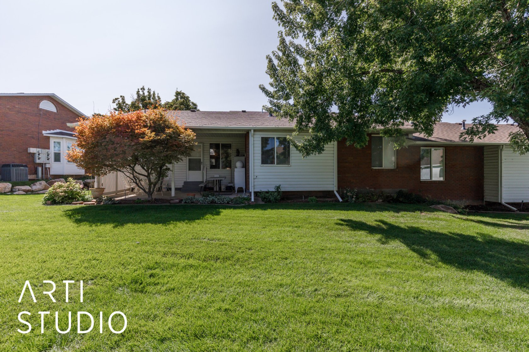 Ranch-style house featuring a front lawn