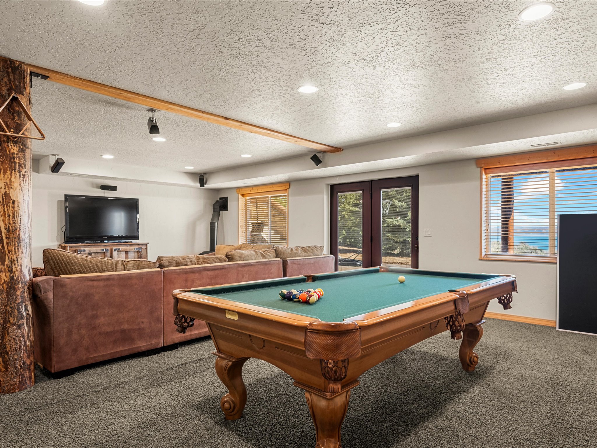 Game room featuring carpet flooring, french doors, a textured ceiling, pool table, and recessed lighting