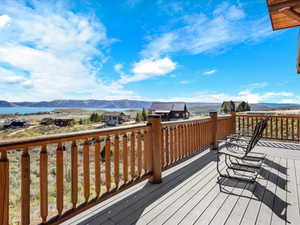 Deck with a mountain view and a residential view