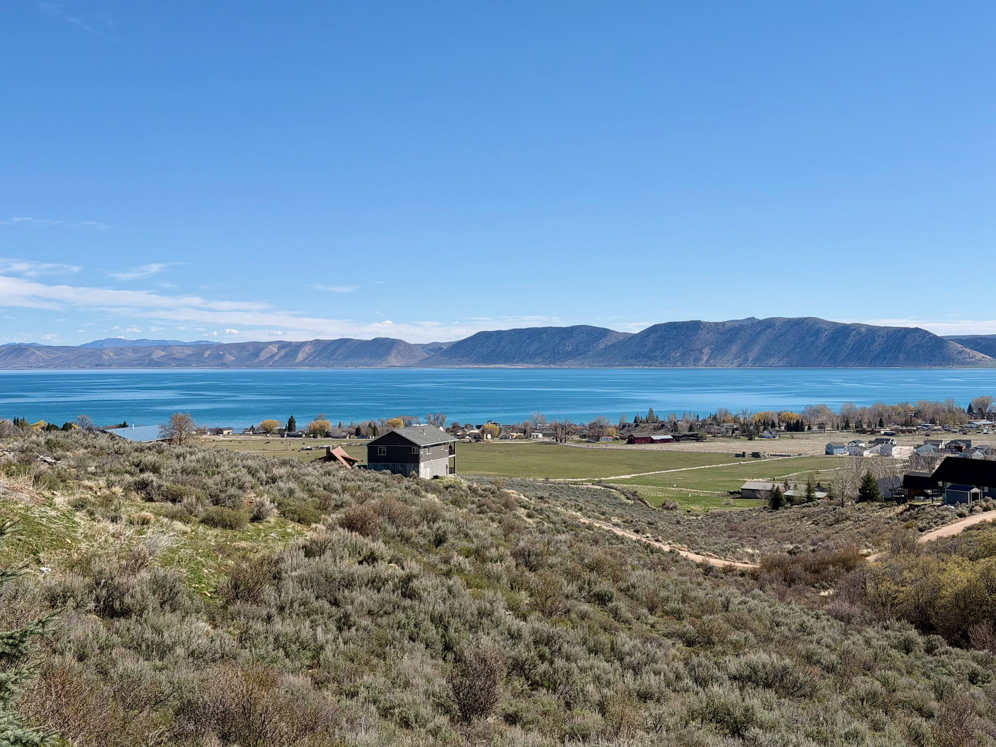 View of mountain backdrop with a nearby body of water