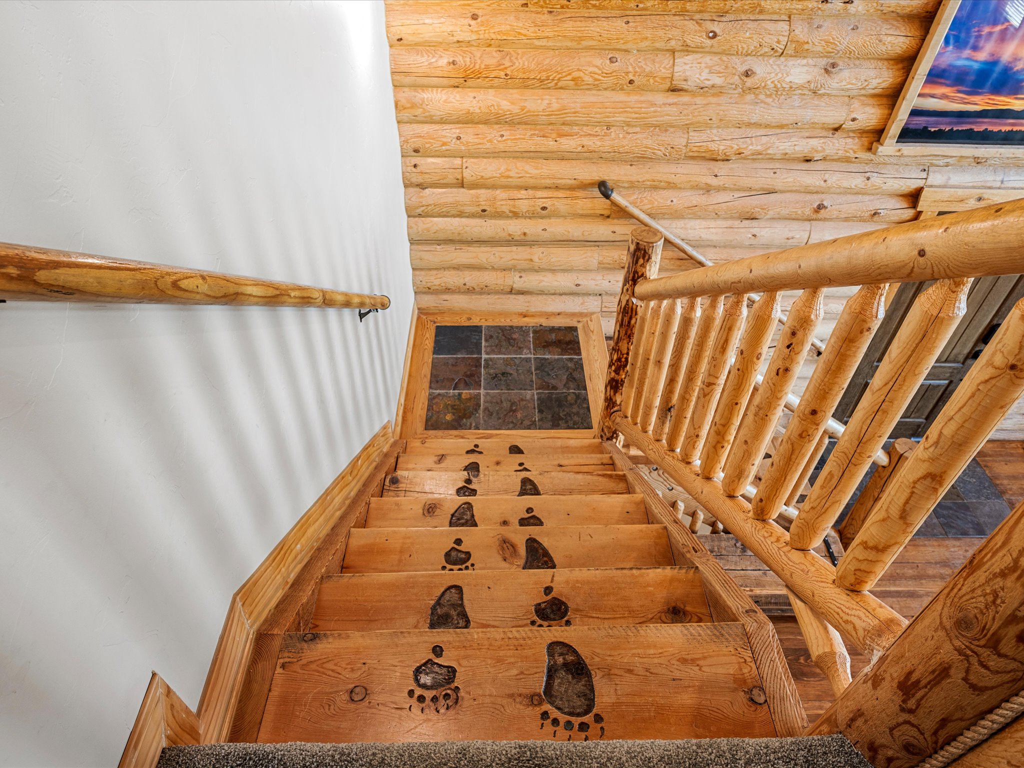 Stairs featuring rustic walls