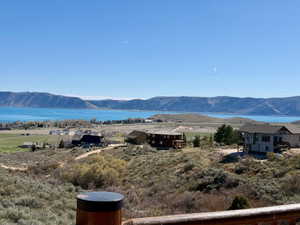 View of mountain backdrop featuring a nearby body of water