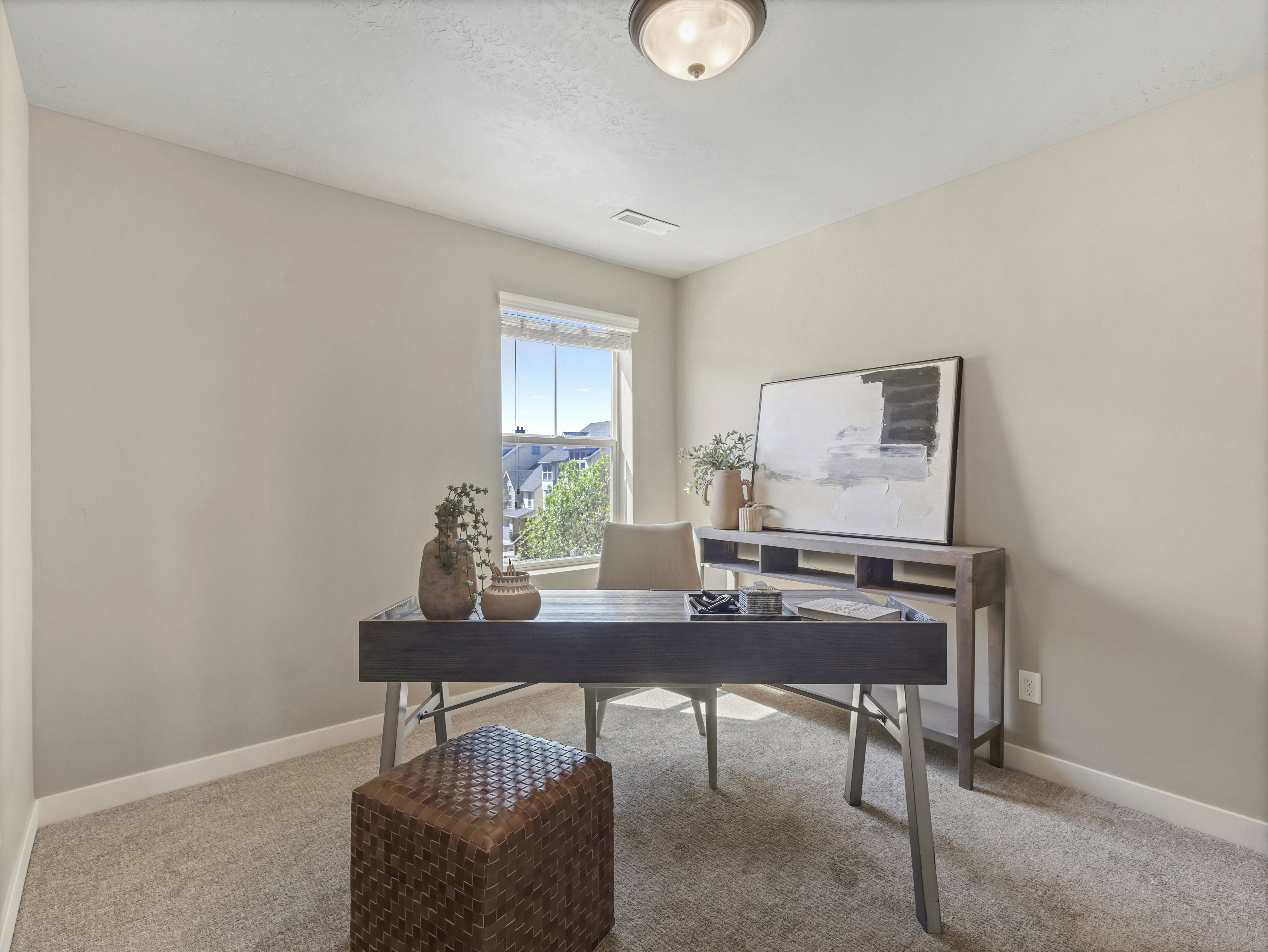 Home office featuring light carpet
