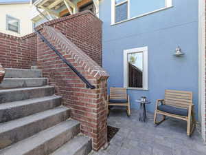 View of staircase and courtyard porch