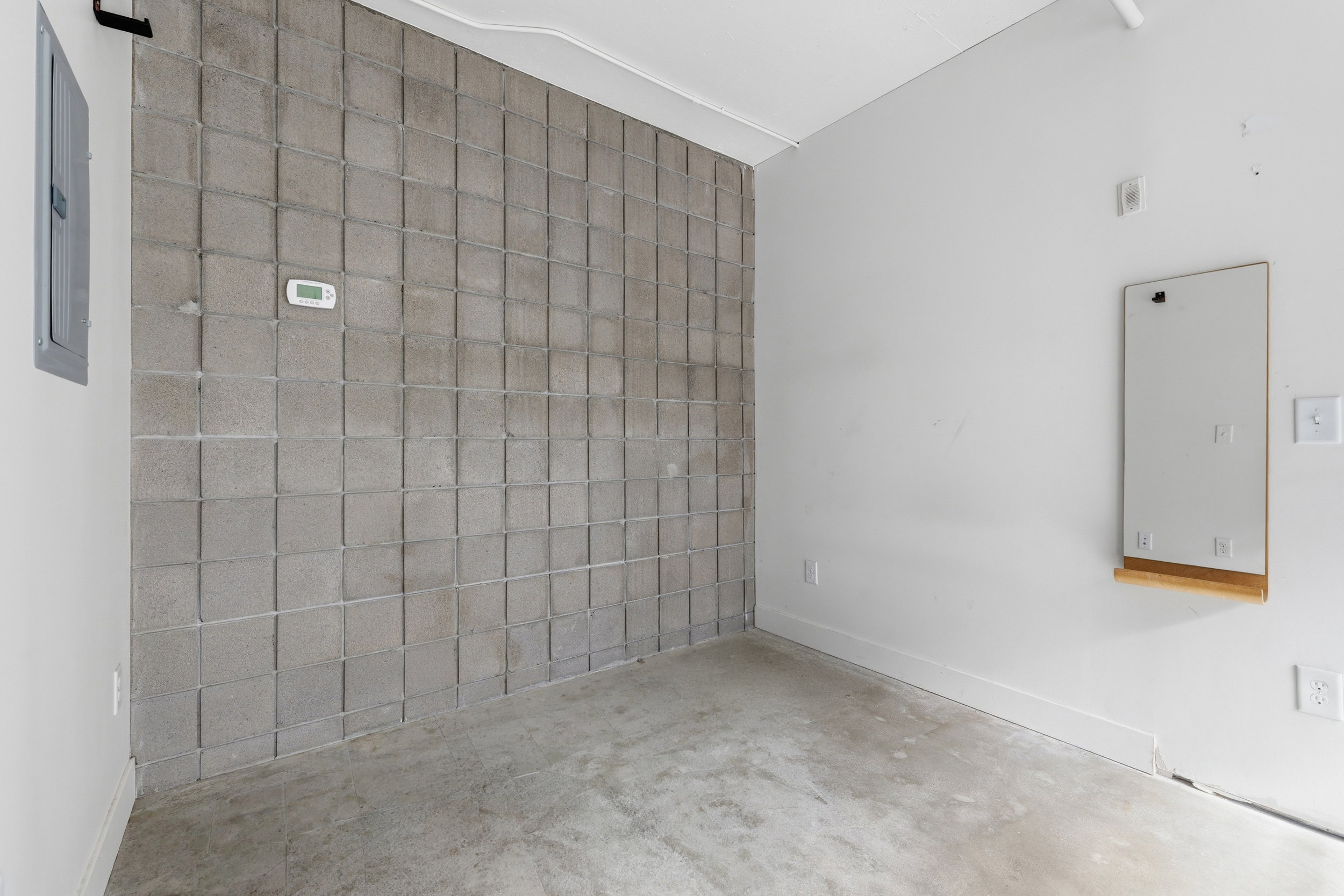 Concrete block accent wall with thermostat