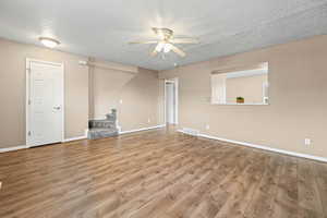 Living room featuring open bar window into kitchen