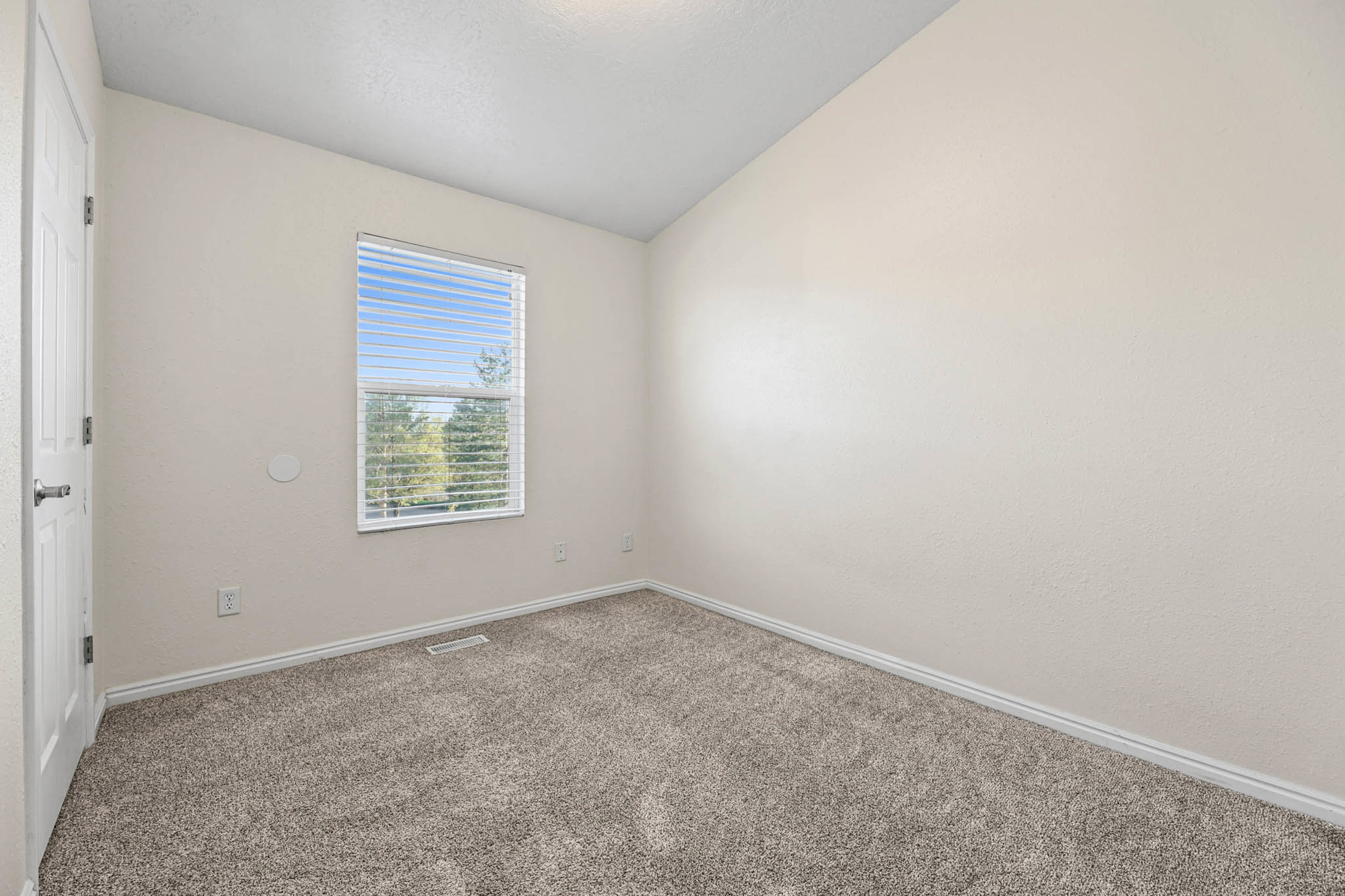 Bedroom #3 with vaulted ceiling, two toned paint and newer carpet