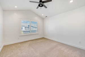 Empty room featuring carpet, a ceiling fan, and recessed lighting