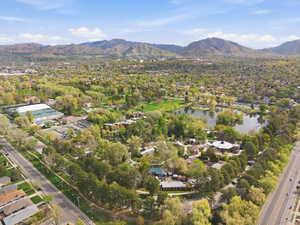 Aerial view of residential area featuring a water and mountain view