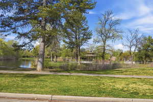 View of home's community with a water view and a gazebo