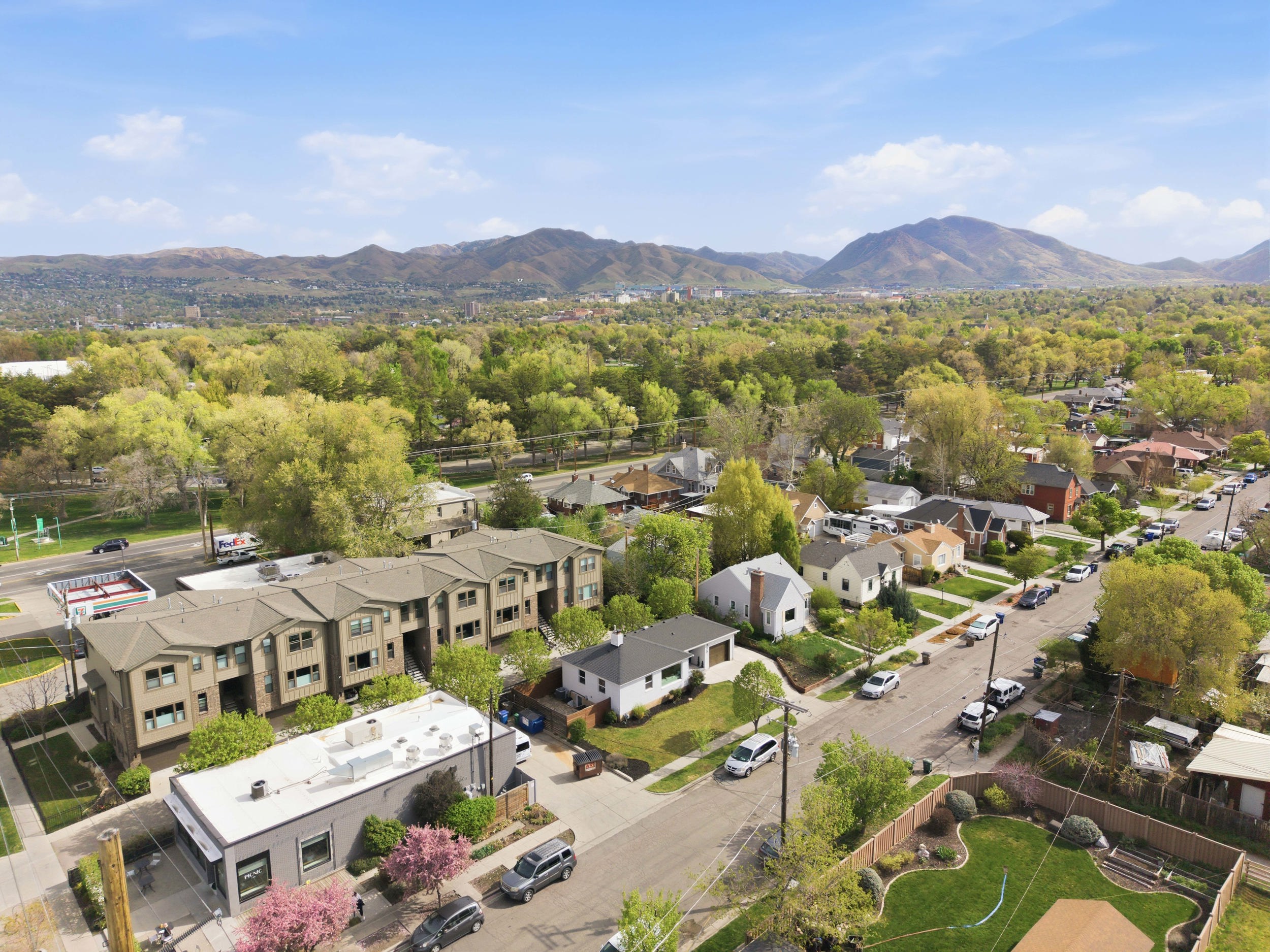 Aerial view of residential area featuring a mountainous background