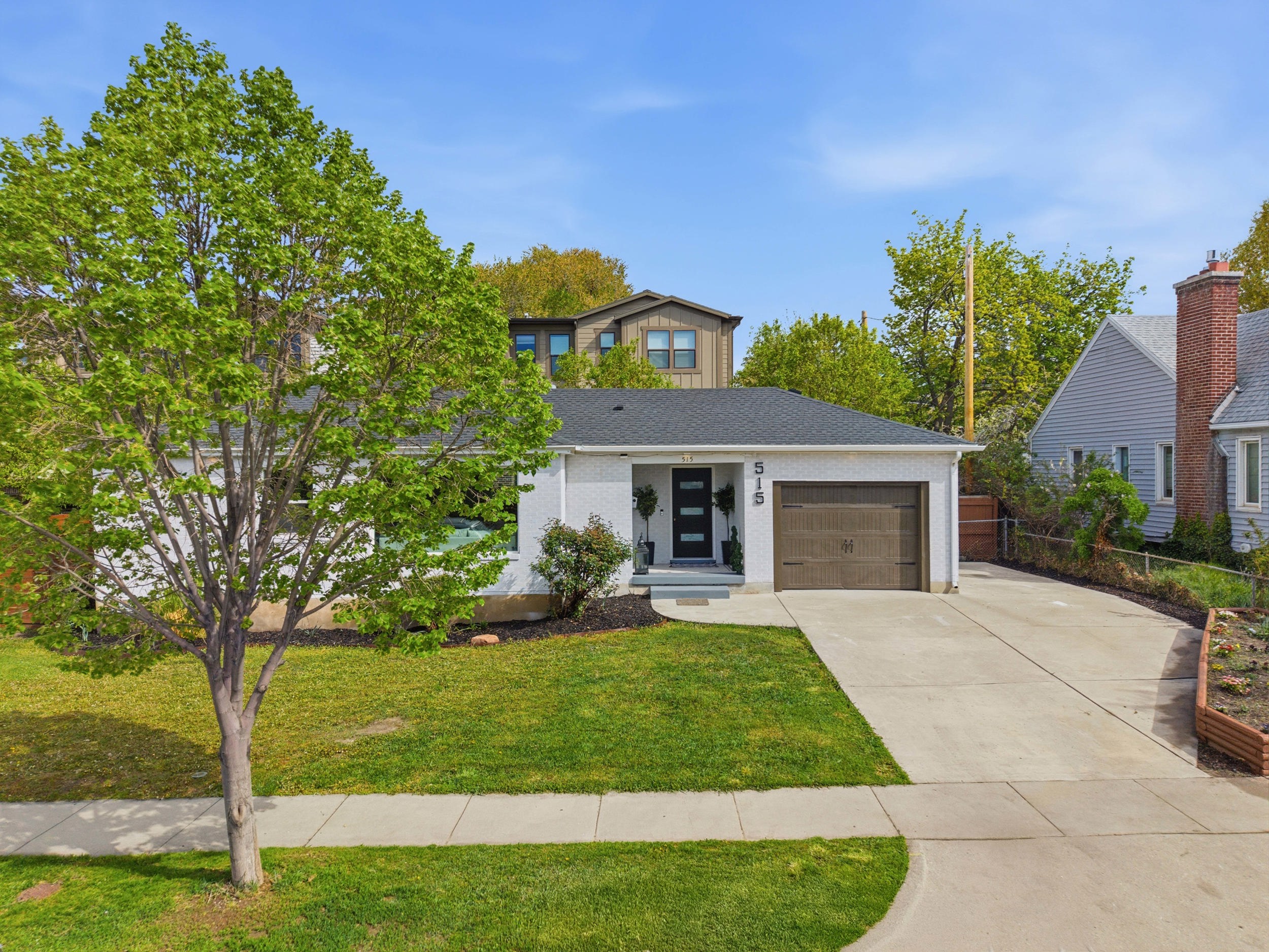 View of front of property featuring driveway and a garage