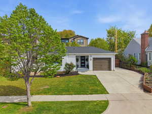 View of front of property featuring driveway and a garage