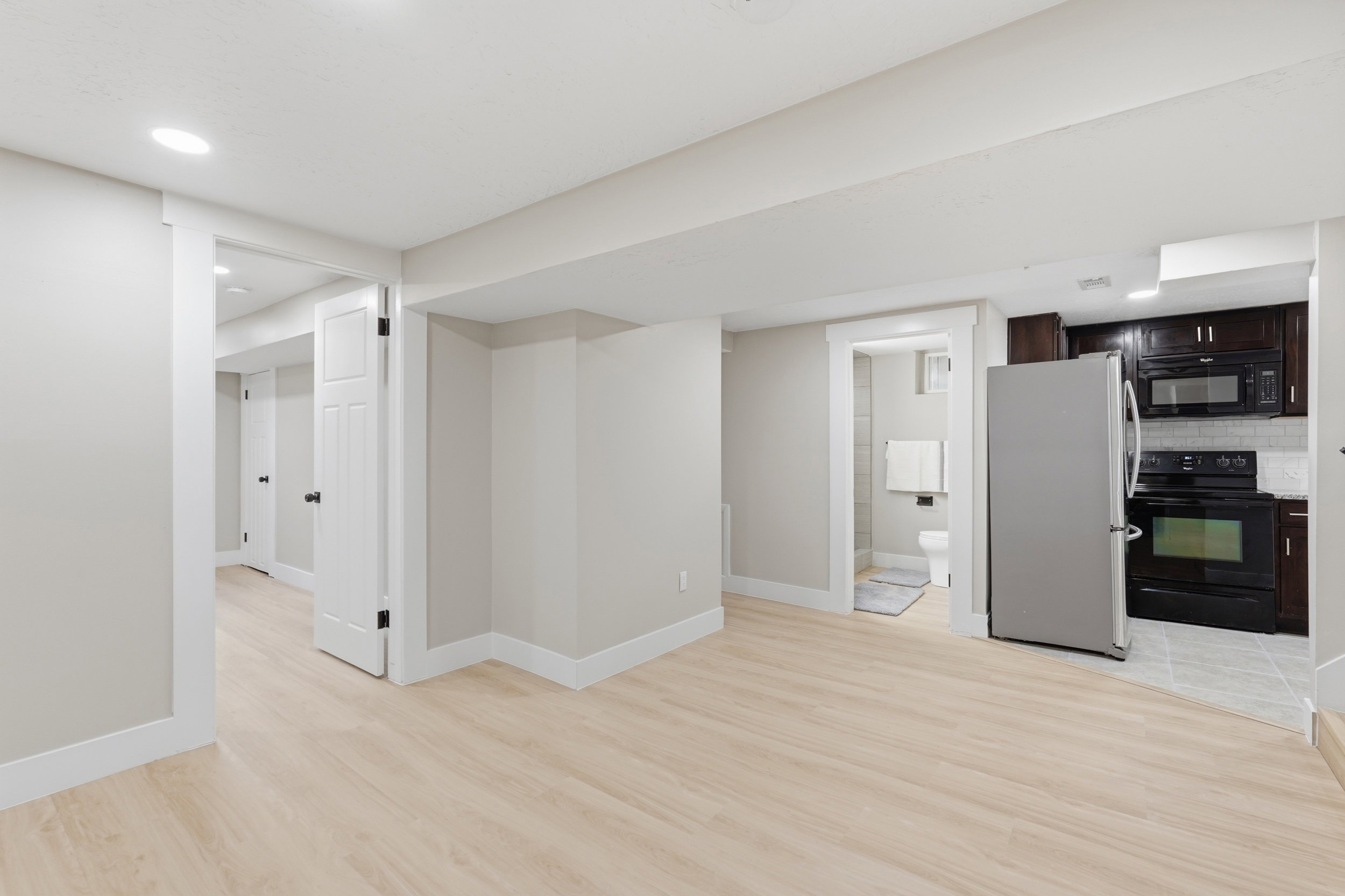 Unfurnished living room featuring light wood finished floors and recessed lighting