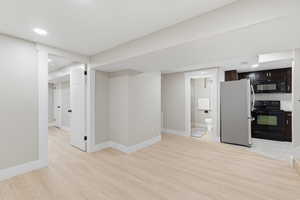 Unfurnished living room featuring light wood finished floors and recessed lighting