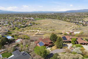 View of property location with a mountain backdrop and nearby suburban area