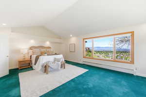 Bedroom featuring a baseboard heating unit, a mountain view, carpet flooring, and recessed lighting