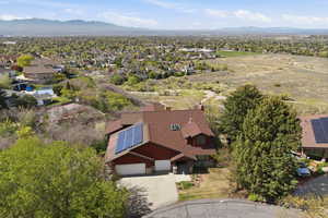 Aerial perspective of suburban area with a mountainous background