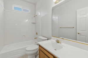 Full bathroom featuring vanity, shower / tub combination, and light tile patterned flooring