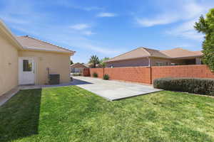 Fenced backyard featuring a patio